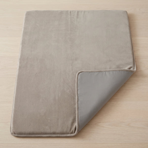 A corner of the mat folded back to show the non-slip backing
