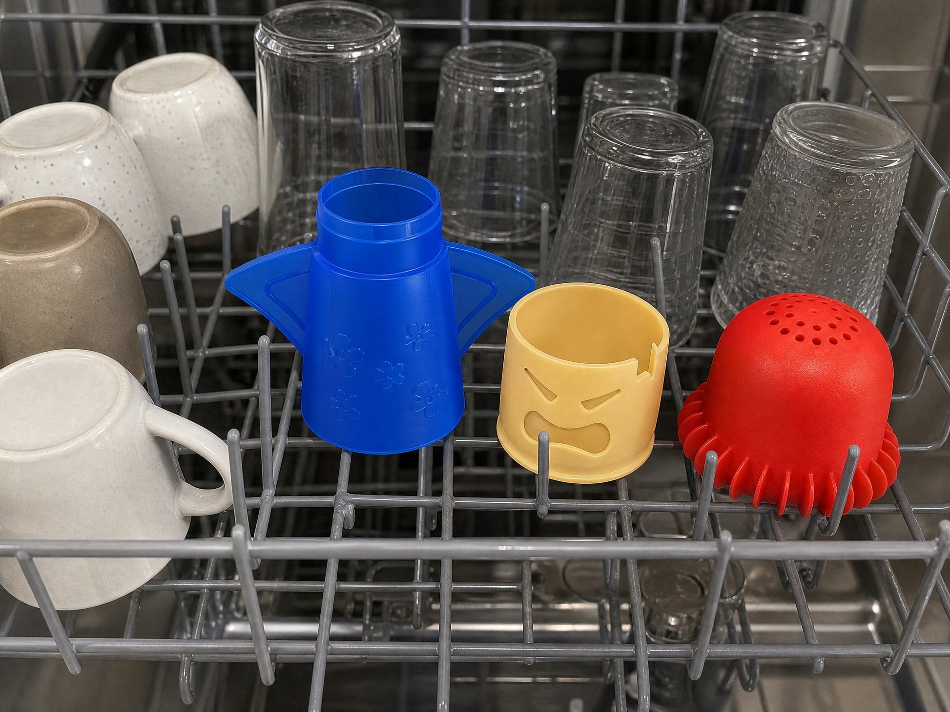 The three parts of the cleaner in the upper basket of a dishwasher