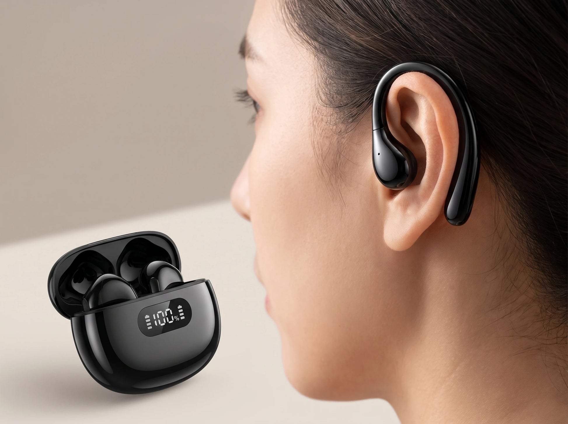 SonaBuds hook earphone worn over the ear, charging case beside it