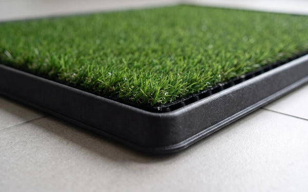 A close view of the splash wall standing above the turf at the corner